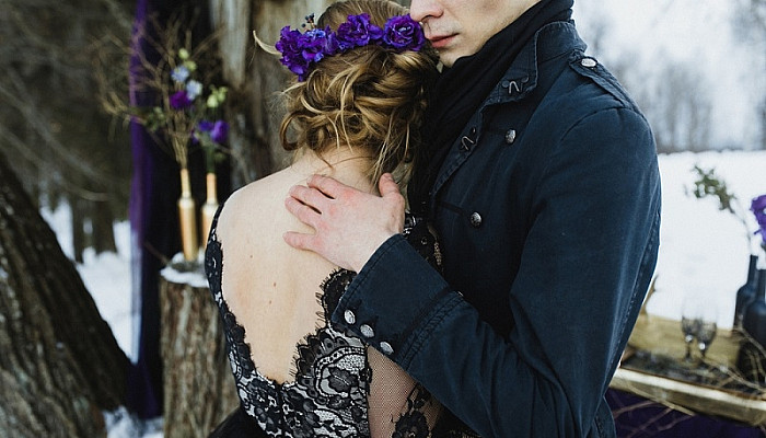 Couple hugging each other at their Gothic Wedding