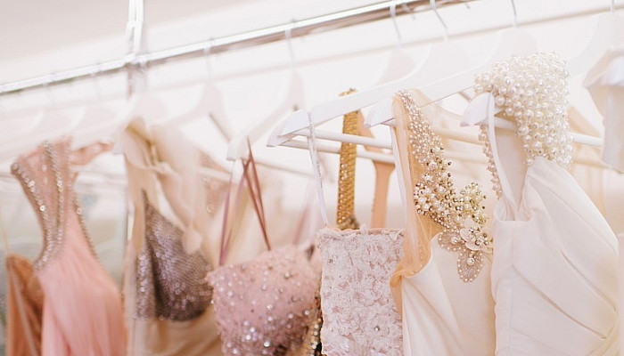 gorgeous pink wedding dresses hanging on racks