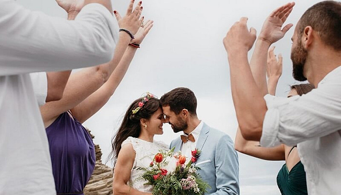 beautiful couple having their wedding on the beach