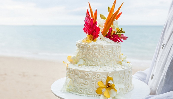 Beautiful cake for wedding ceremony on beach