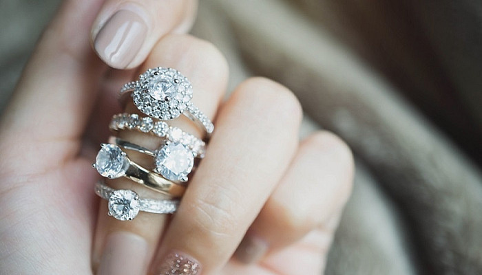 Elegant diamond rings on woman finger