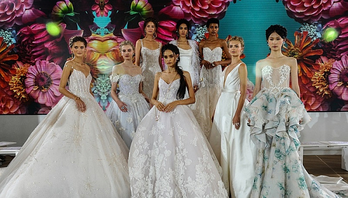 women wearing floral wedding gown