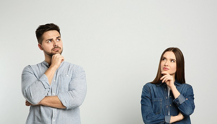 Pensive couple thinking about answer for question