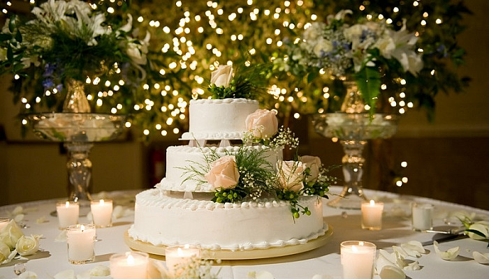 Wedding cake on the decorated table